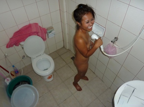 After sucking and fucking, Farang's naked Thai barmaid Reem was taking a shower.