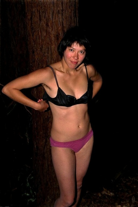 Nighttime: Asian amateur Amanda stripping naked in woods for hairy cunts.