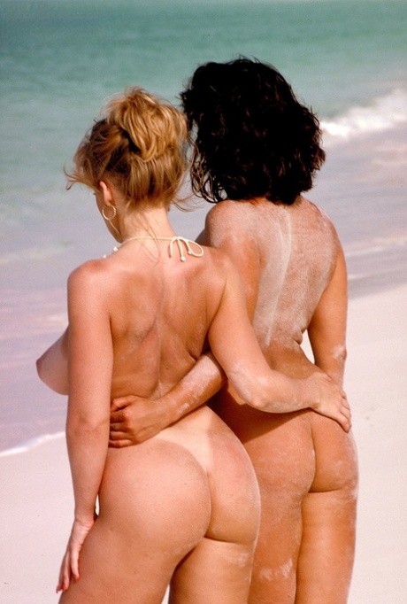 Lesbian romance blossoms between Euro MILF Chloe Vevrier and her big boobed girlfriend on the sandy beach.