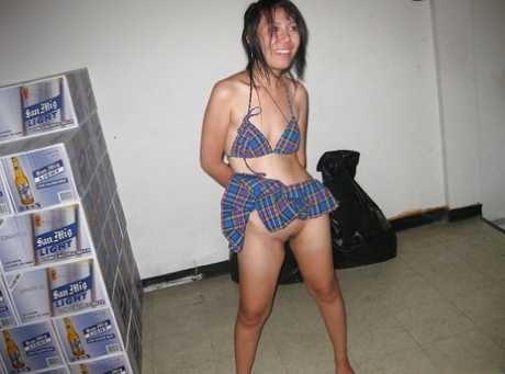 For a good cause, an Asian Thai girl takes off her clothes to pose for the camera and pretends to have both hands on as well as the butt