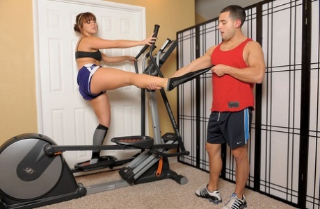 Female amateur Alice Bell performs a foot massage on her male partner after an aerobic exercise.