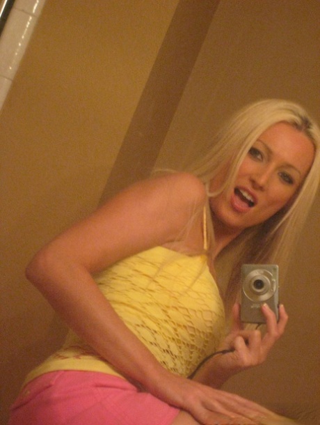 Nap time: Blonde amateur Diana Doll poses for selfies in the bathroom.