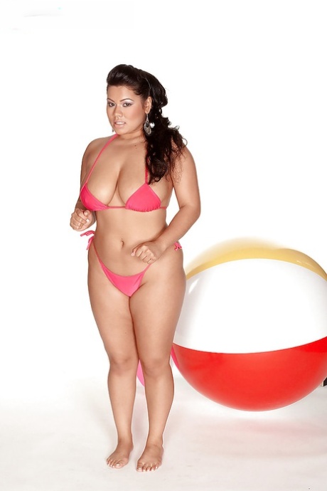 In a bikini, Lanea Love displays her big tits as the fat brunette babe.