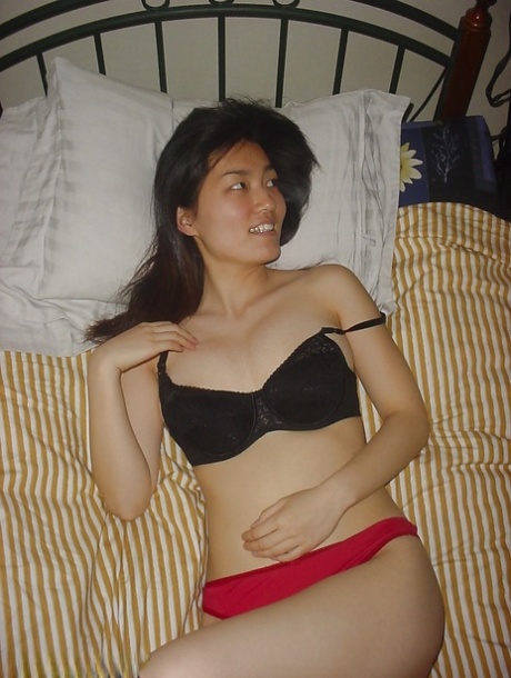 She's an alluring Asian babe, showing off her big tits and falling asleep in the process.