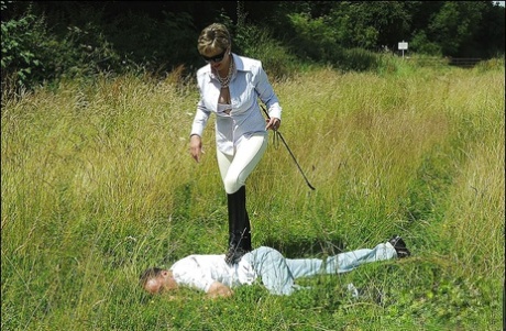 While out in the open, her boy slave wears sunglasses and is exposed to a busty, adult-looking manly wound.