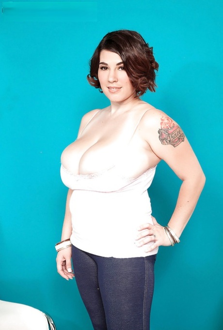 Elaina Gregory, a brunette with large breasts and arms, was seen changing her attire.