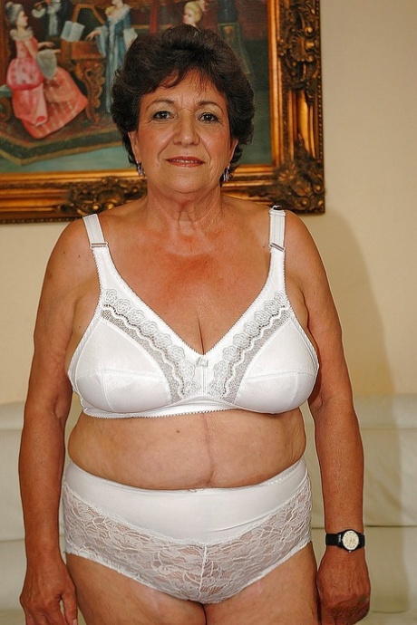 Dressed in lingerie, Fatty Granny goes nude to exhibit her wet cunt.