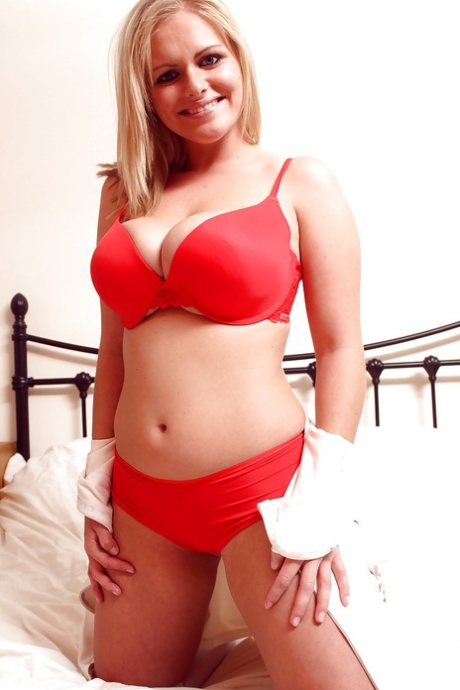 Curvaceous teen blonde taking off her nurse uniform and lingerie