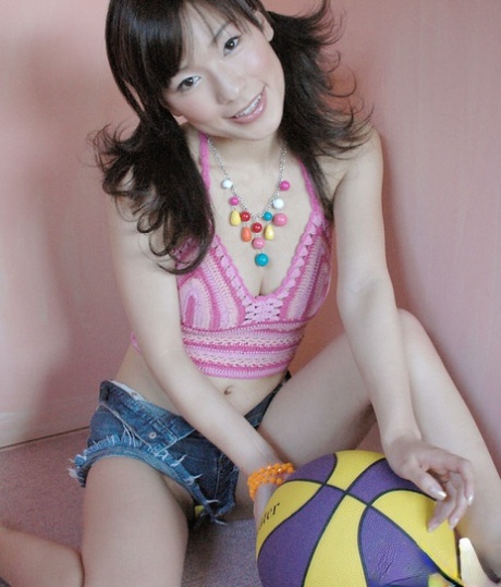 An emaciated Asian female in stockings displays her attractive curves.