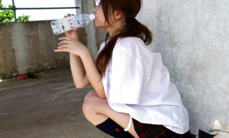 Lovely asian babe Miyu Sugiura taking off her school uniform outdoor