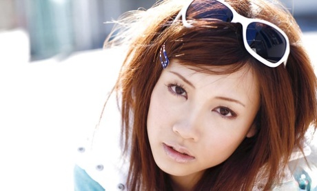 Reika Shina, the stunning Asian lady, was photographed stripping and spreading her legs.