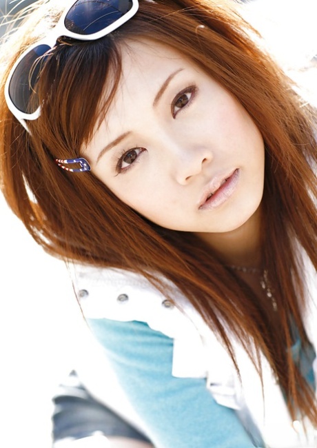 Reika Shina, a stunning Asian model, was photographed stripping and spreading her legs.