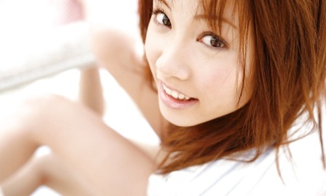 Extensive legs stripped and spread out by Reika Shina, the stunning Asian babe with blonde locks.