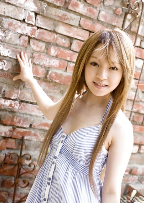 Stunning naked Asian girl Ria Sakurai flaunching her elegant figure outside.