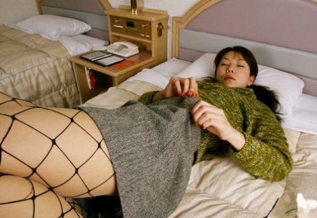 An attractive Asian girl wearing pantyhose, Kurumi Morishita, was seen taking off her clothes.