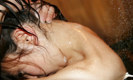 In the midst of a bathing session, Momo Yoshizawa is seen with her svelte Asian partner.