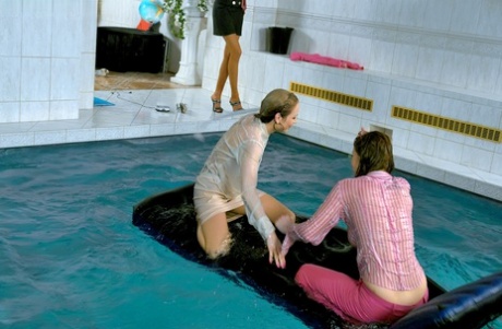 Fully clothed fetish ladies having some wet fun in the pool #13
