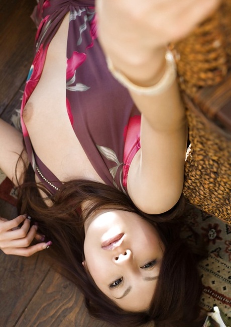 A cute and petite Asian female, Shinohara Ryou exposes her curves.