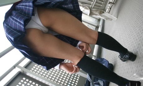 In uniform, a lusty Asian coed was seen wearing panties and small pink tits.