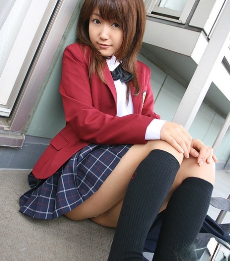 Lusty asian coed in uniform flashing her panties and tiny tits