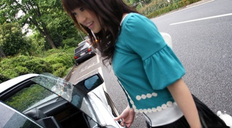 A frisky Asian female displaying her firm breasts.