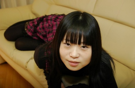Asian girl: Rio Takei, a playful schoolgirl getting rid of her clothes.