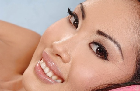 The foxy Asian bunny babe disrobing her panty and pleasureing herself.