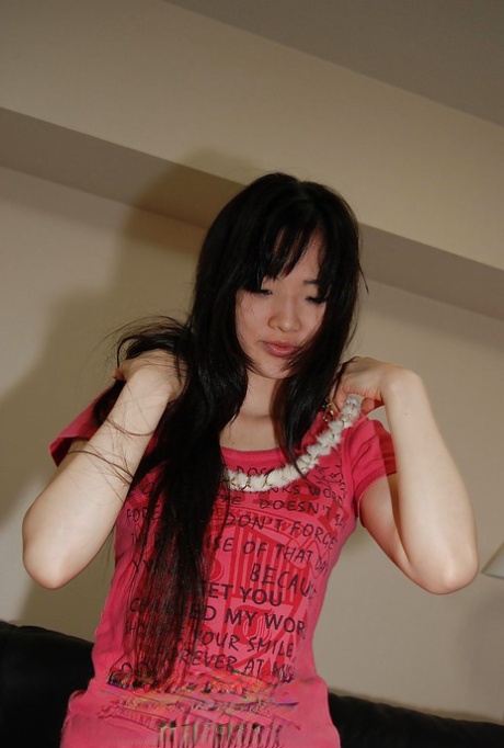 Long-haired asian teen Aika Tanuma stripping and toying her cunt