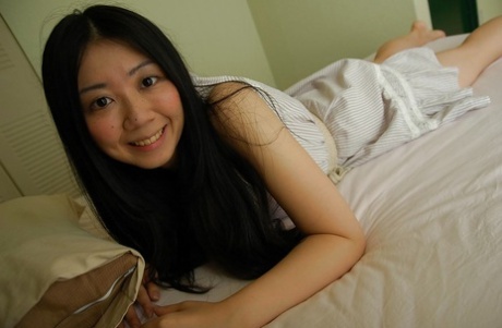 Asian teen Jun Matsubara undressing and spreading her lower lips