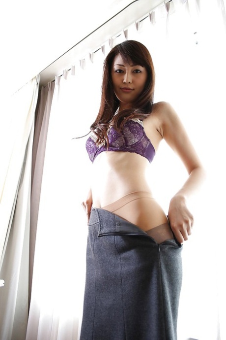 Aoi Katayama, the beautiful MILF, is seen undressing and rubbing shoulders with her hair in a messy manner.