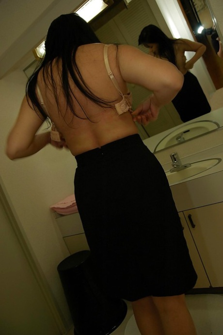 A sassy and mature Asian woman, Sachiko Matsushita, showering.
