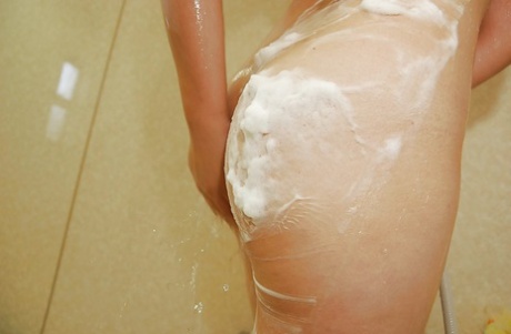 Asian teen Chihiro Tanabe has some foamy fun in the shower