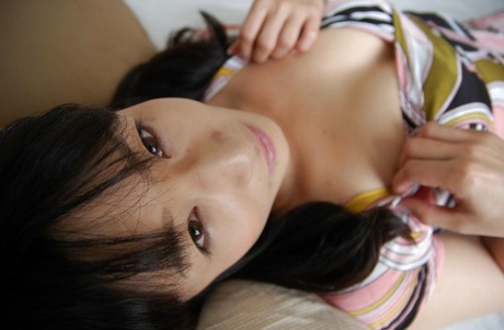 A picture of Yukie Minagawa, the Asian babe, undressing and her pussy freely?