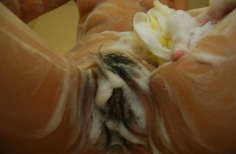 During the shower, Nao Kodaka from Asia displays her hairy shaver.