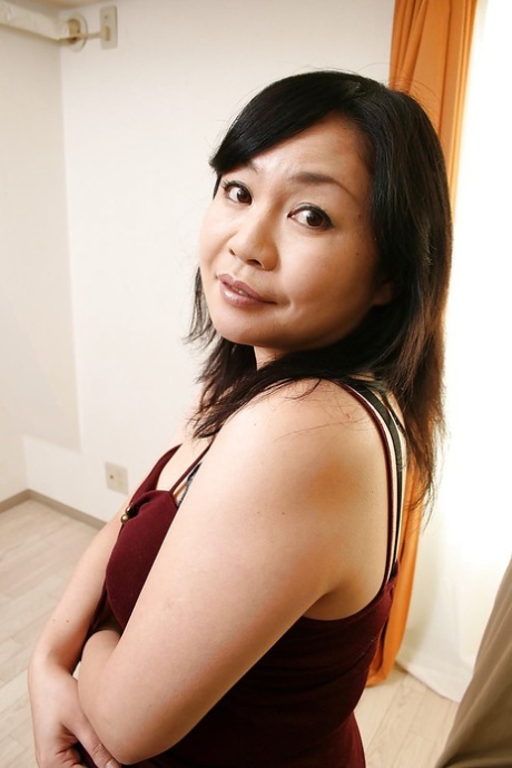 Shy and curvy, the asian MILF member named Rumiko Shiga is taking off her clothes.