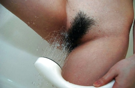 Busty asian teen Ayaka Kimura taking shower and exposing her twat in close up