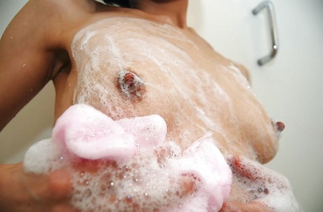 Asian male athlete Makoto Abe enjoying a hot shower and having her hair peeled off.