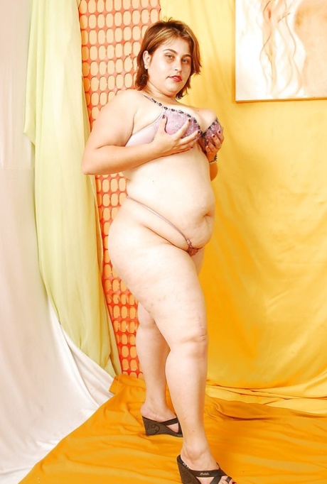 SSBBW model Naughty and Unflattering: The naked naked beauty is shown here undressing and showing off her flabby body.