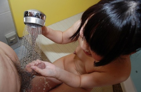 Asian teen Chisa Nagata gives a sensual hand and blowjob in the bathroom
