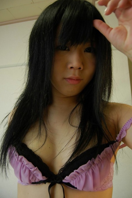 Shy asian teen getting nude and showing off her hairy gash in close up