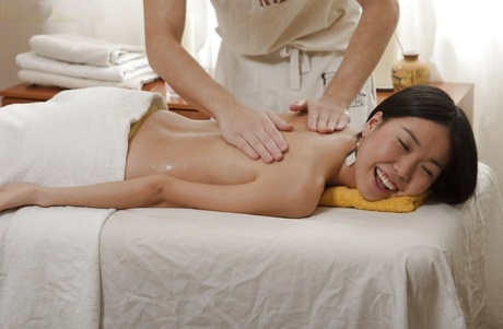 An Asian girl with slouched abs gets a sensual massage and has a good time getting plucky.