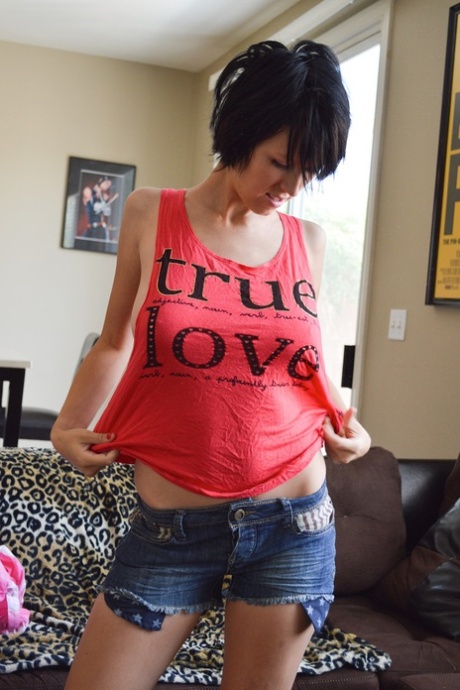 Dark haired teen Velvetine shows her big natural breasts while changing