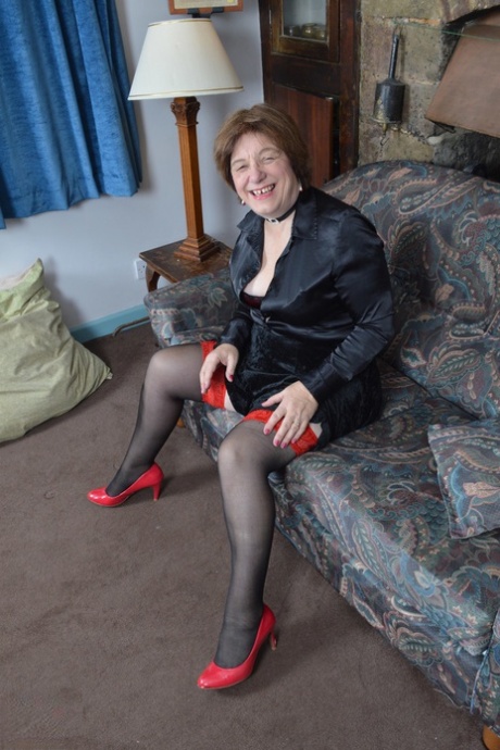 Chubby granny Janet Wilson exposes herself to her nylon stockings while masturbating.
