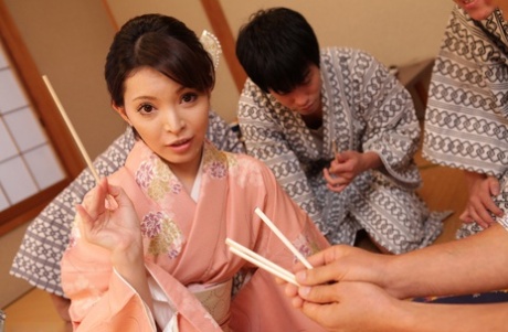 Hikaru Kirishima, a Japanese wife, takes off her robe and is then sexually assaulted by several men.