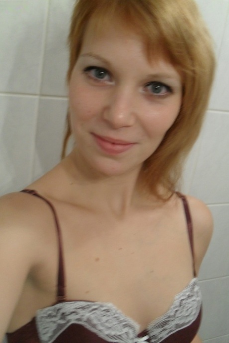 Amateur teen Electra Angel takes a photo of her body while showering herself