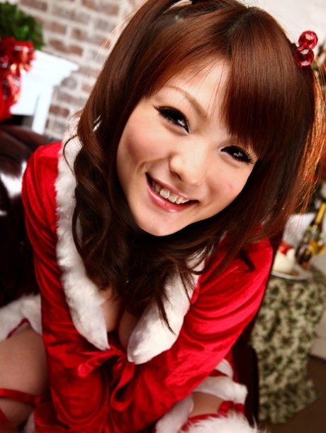 An Asian girl named Fuwari receives her nappy in a threeway session held during Christmas.