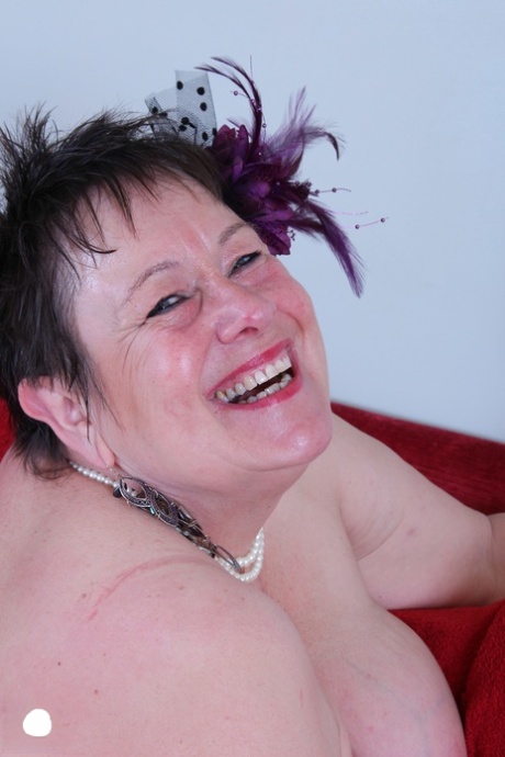 The BBW Honey, with short hair, exposed her large breasts and displayed an older body in the act.