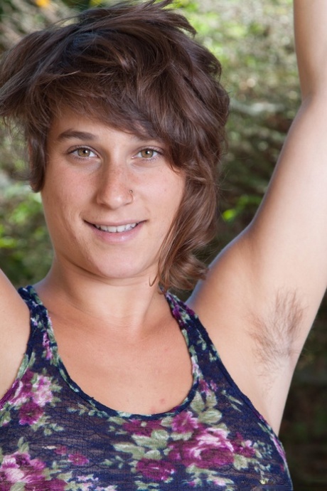 Adorable amateur brunette Sayge loses her top and small short to showcase her hairy body.
