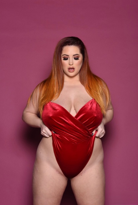 British fat woman Lucy Vixen patting her breasts with all her strength.