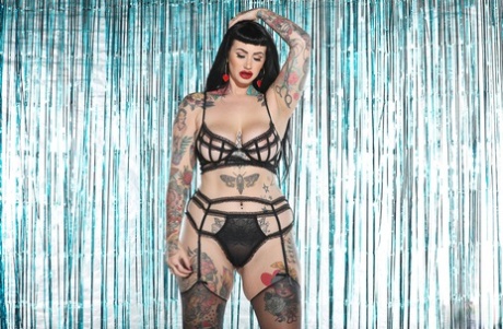 While stripping off her lingerie, Fatty Galda Lou showcases her big tits and tattooed body.